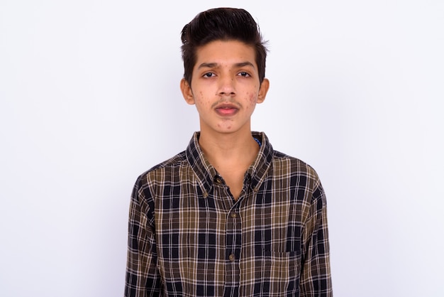 young handsome Indian hipster teenage boy on white