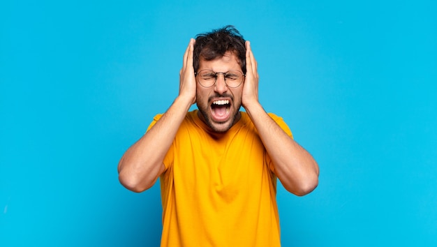 Young handsome indian man angry expression