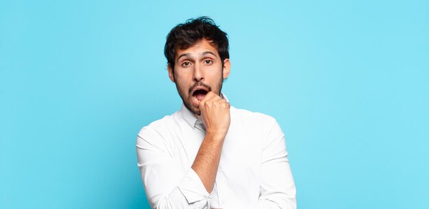 Young handsome indian man doubting or uncertain expression