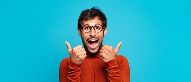 Young handsome indian man happy expression