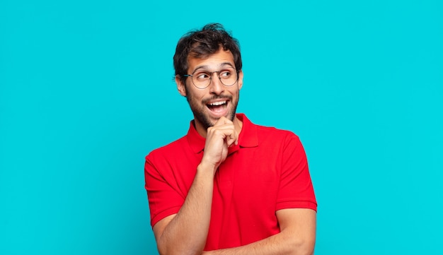 Young handsome indian man surprised expression