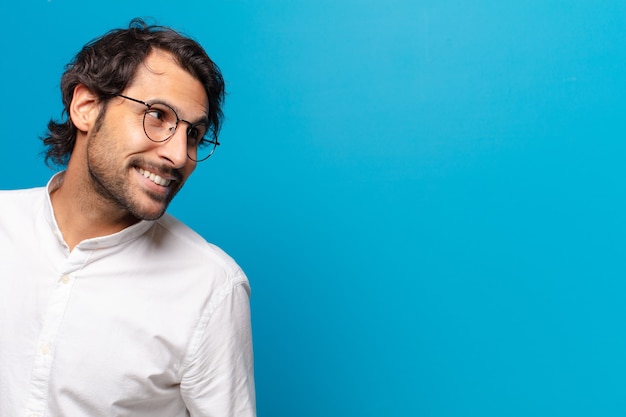 Young handsome indian man thinking or doubting expression