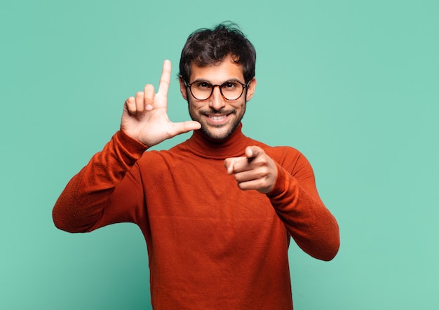 Young handsome indian man with happy expression