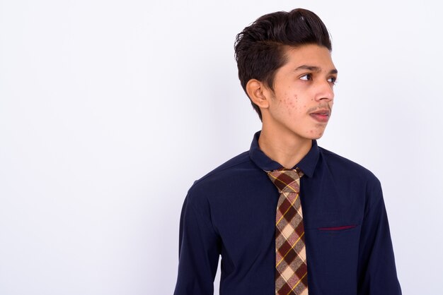 young handsome Indian teenage boy as businessman on white