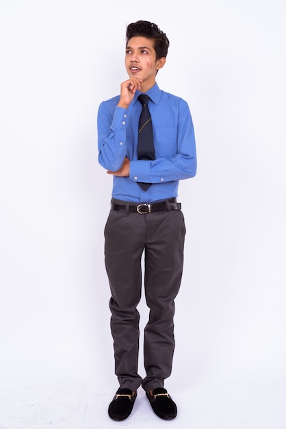 young handsome Indian teenage boy as businessman on white