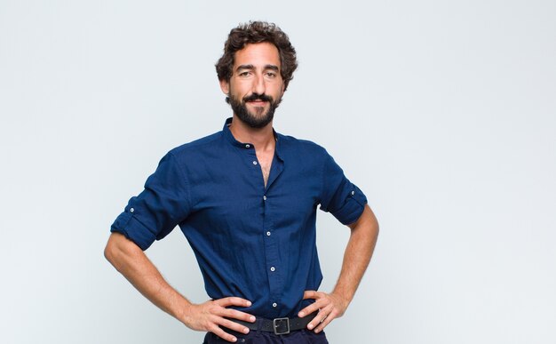 Young handsome latin man in shirt isolated