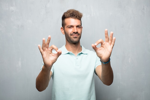 Photo young handsome man all right gesture