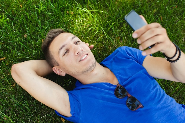 Young handsome man in a blue t-shirt