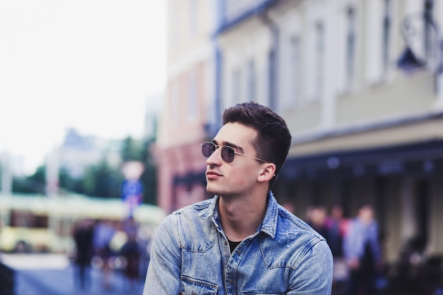 Young handsome man in denim shirt