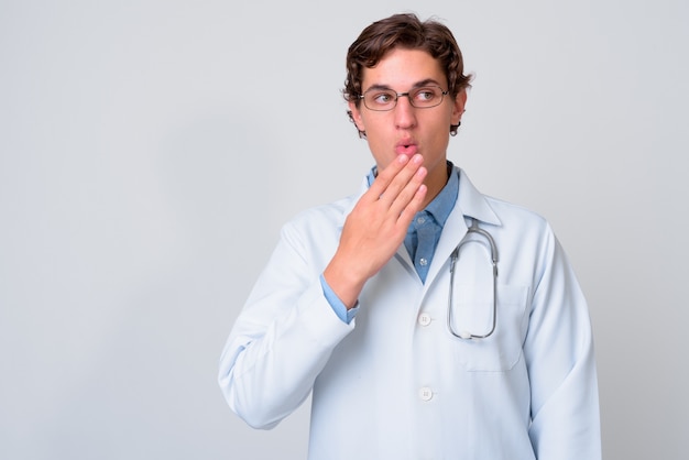 young handsome man doctor wearing eyeglasses