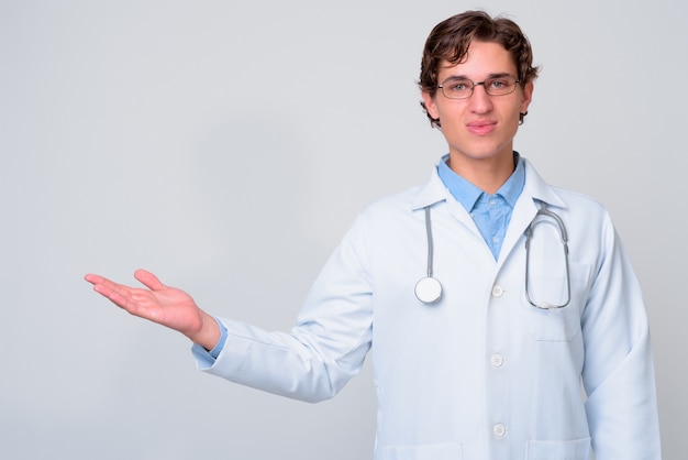 young handsome man doctor wearing eyeglasses