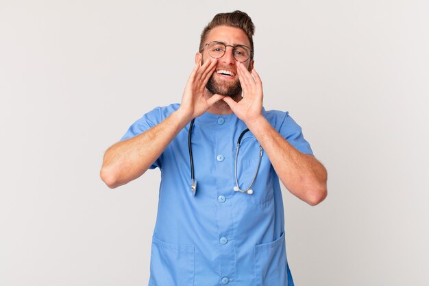 Young handsome man feeling happy,giving a big shout out with hands next to mouth. nurse