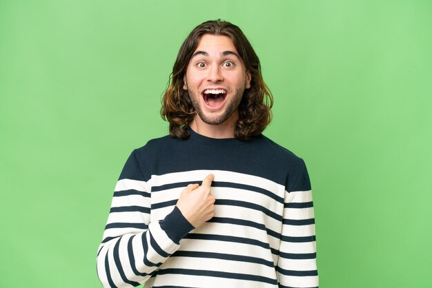 Young handsome man over isolated background with surprise facial expression