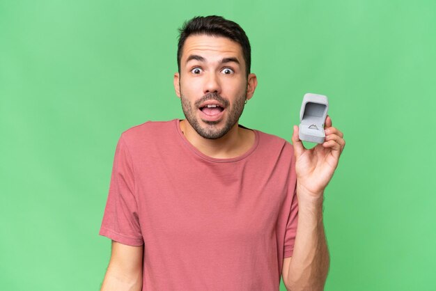 Young handsome man over isolated background