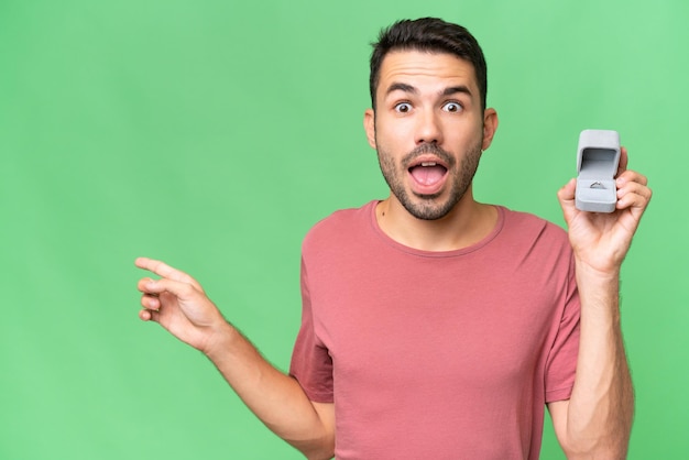 Young handsome man over isolated background