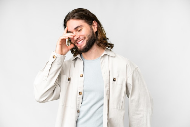 Young handsome man over isolated white background laughing