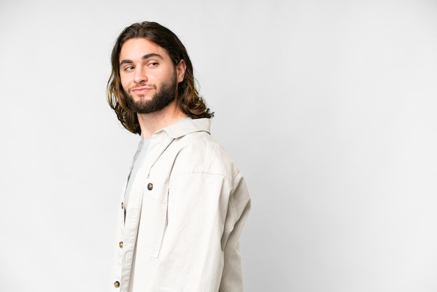 Young handsome man over isolated white background Portrait