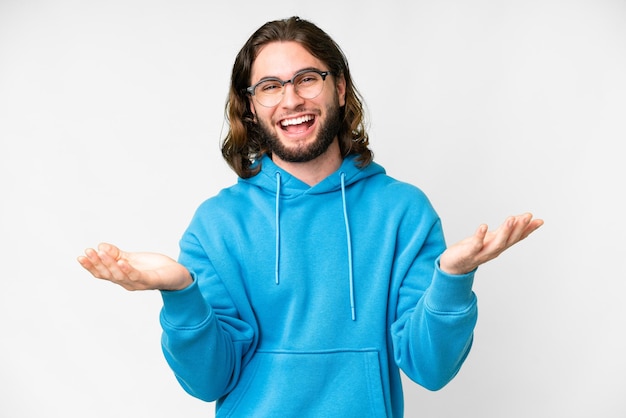 Young handsome man over isolated white background with shocked facial expression