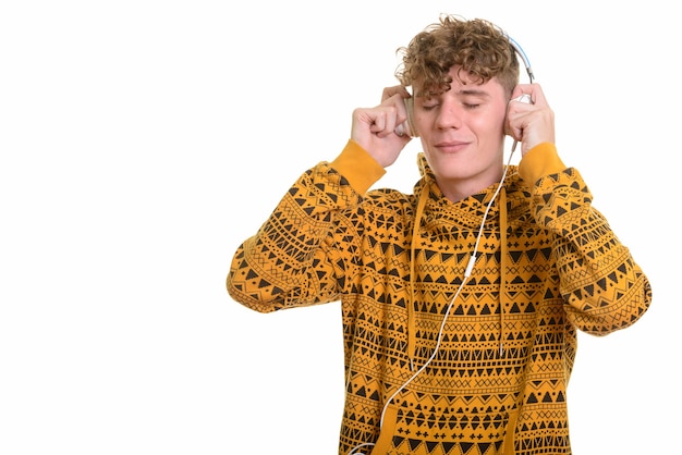 Young handsome man listening to music