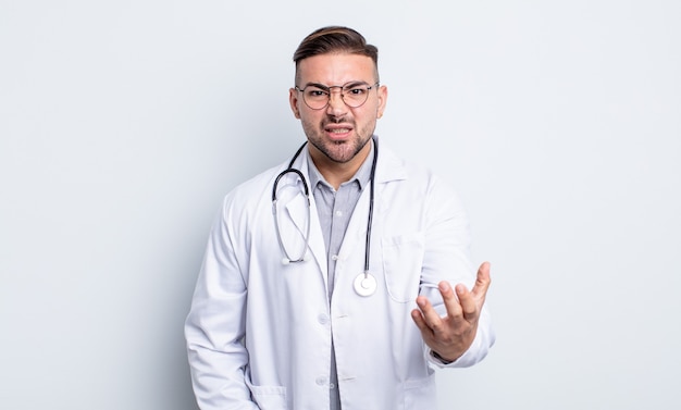 Young handsome man looking angry, annoyed and frustrated. physician concept