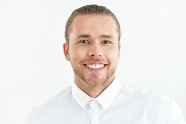 Young handsome man portrait, posing against white background