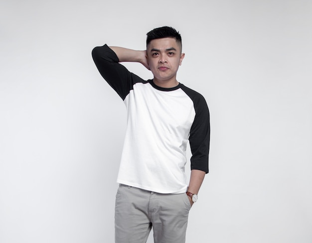 Young handsome man posing wearing raglan t-shirt 