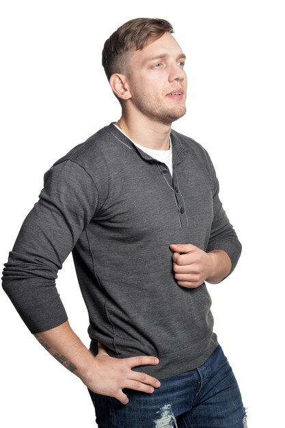 Young handsome man posing on white background