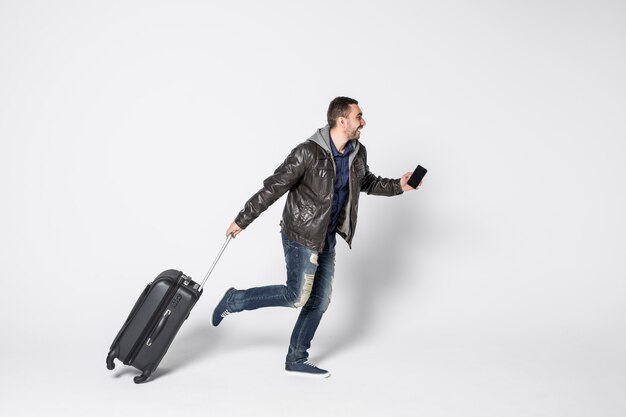 Young handsome man running with bag isolated on white background