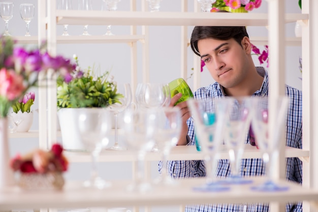 Young handsome man shopping in shop