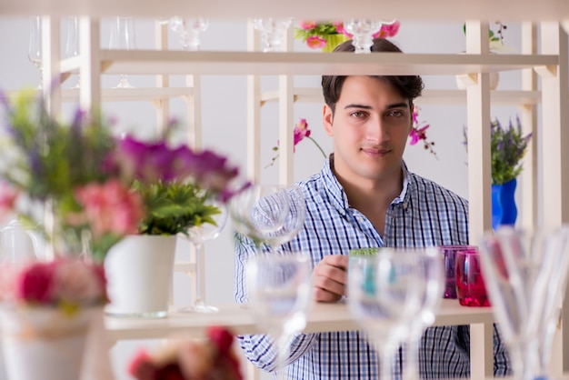 Young handsome man shopping in shop