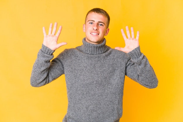 Photo young handsome man showing number ten with hands