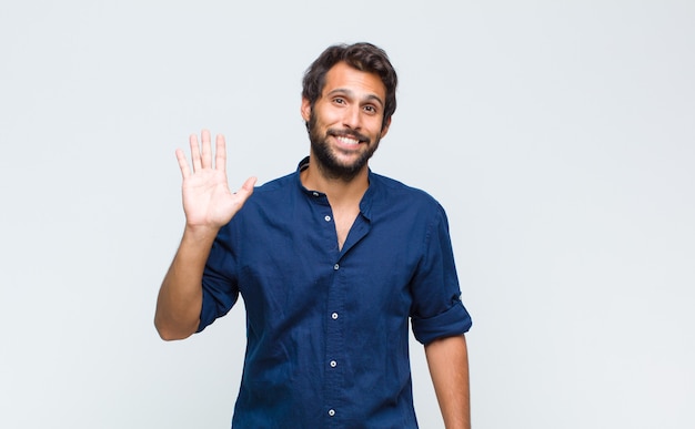 Young handsome man smiling cheerfully