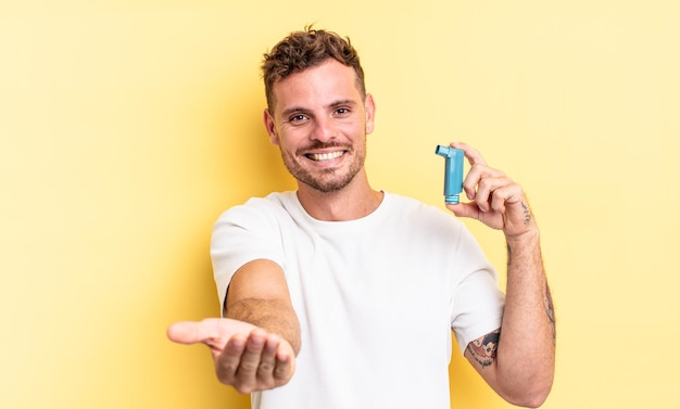 Young handsome man smiling happily with friendly and  offering and showing a concept. asthma concept