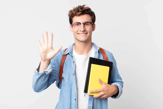 Young handsome man smiling and looking friendly, showing number five. university student concept