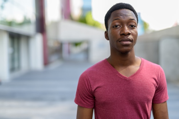 Young handsome man in the streets outdoors