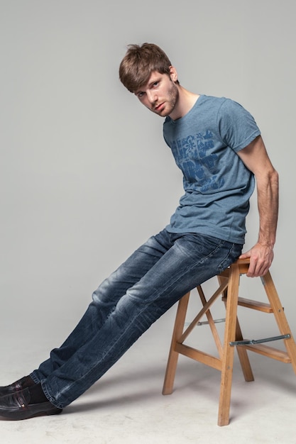 Young handsome man studio fashion portrait