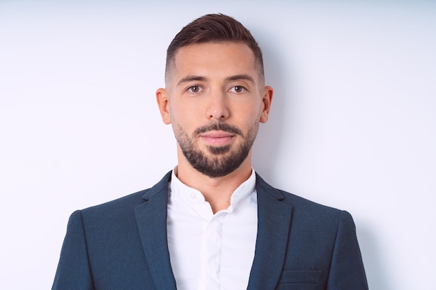 Young handsome man in suit isolated on a white background Businessman isolated office people