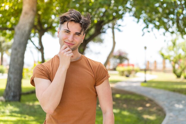 Young handsome man thinking