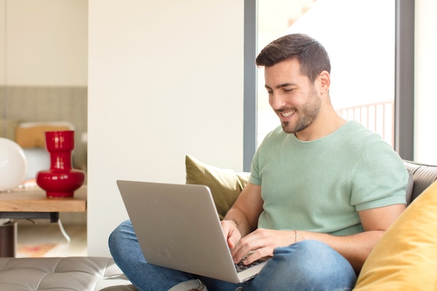 Young handsome man using a laptop