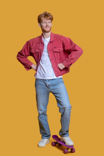 Young handsome man using skateboard