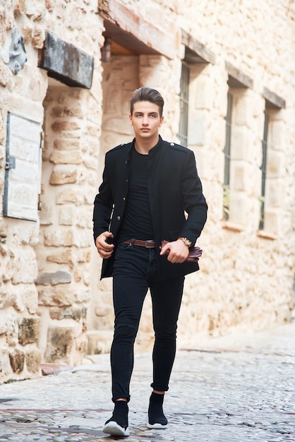 Young handsome man wearing black clothes