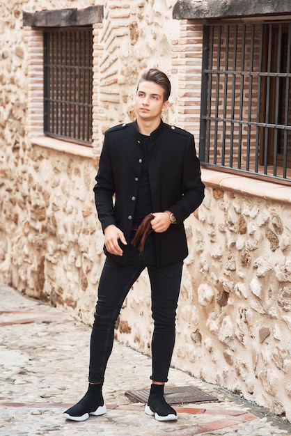 Young handsome man wearing black clothes