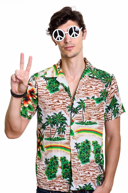 Premium Photo | Young handsome man wearing sunglasses with peace sign