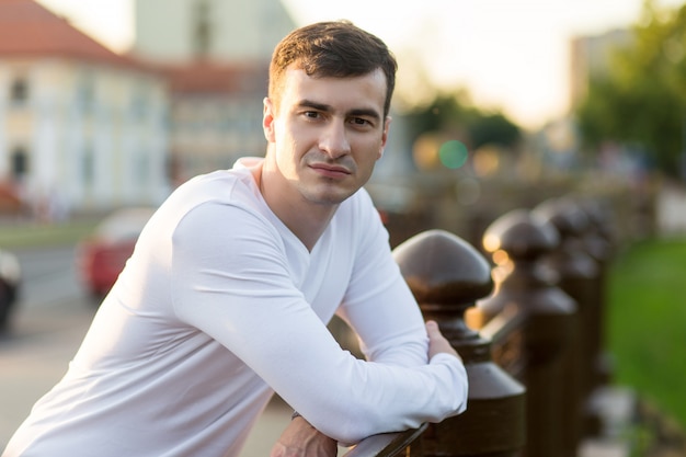 Young handsome man in white wear