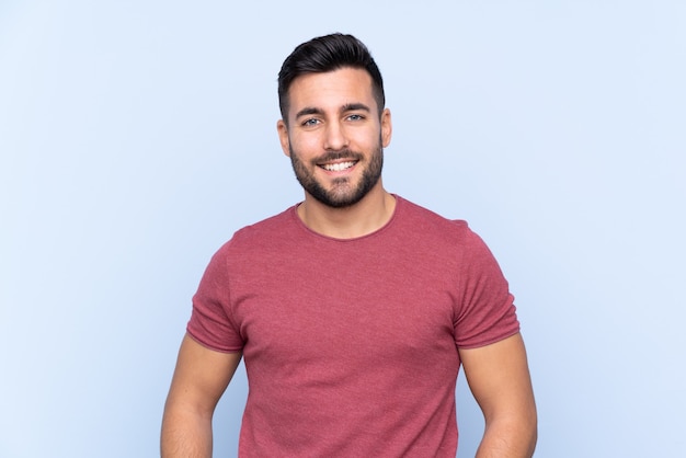 Young handsome man with beard isolated laughing