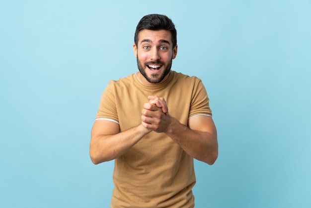 Young handsome man with beard laughing