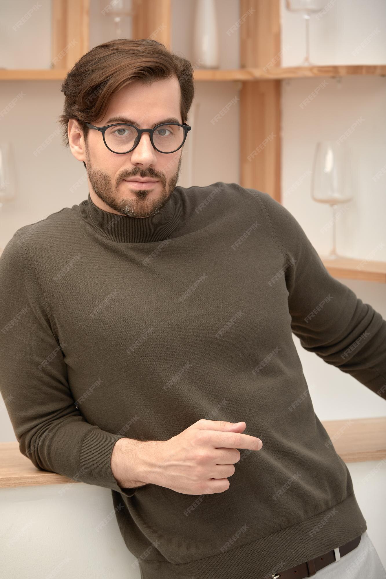 A man with a goatee and a turtle neck sweater photo – Man face