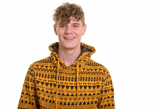 Young handsome man with curly blond hair wearing hoodie