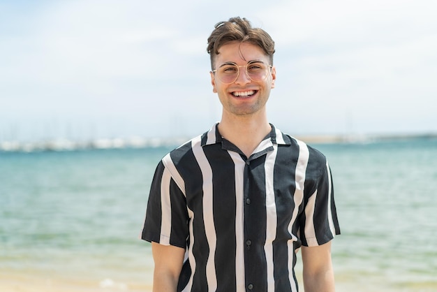 young handsome man with glasses with happy expression