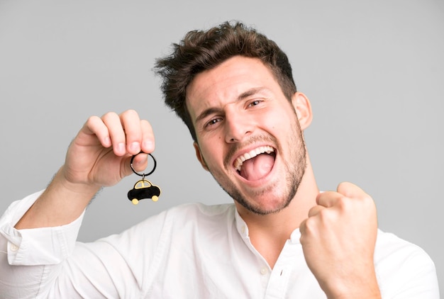 young handsome man with his first car key